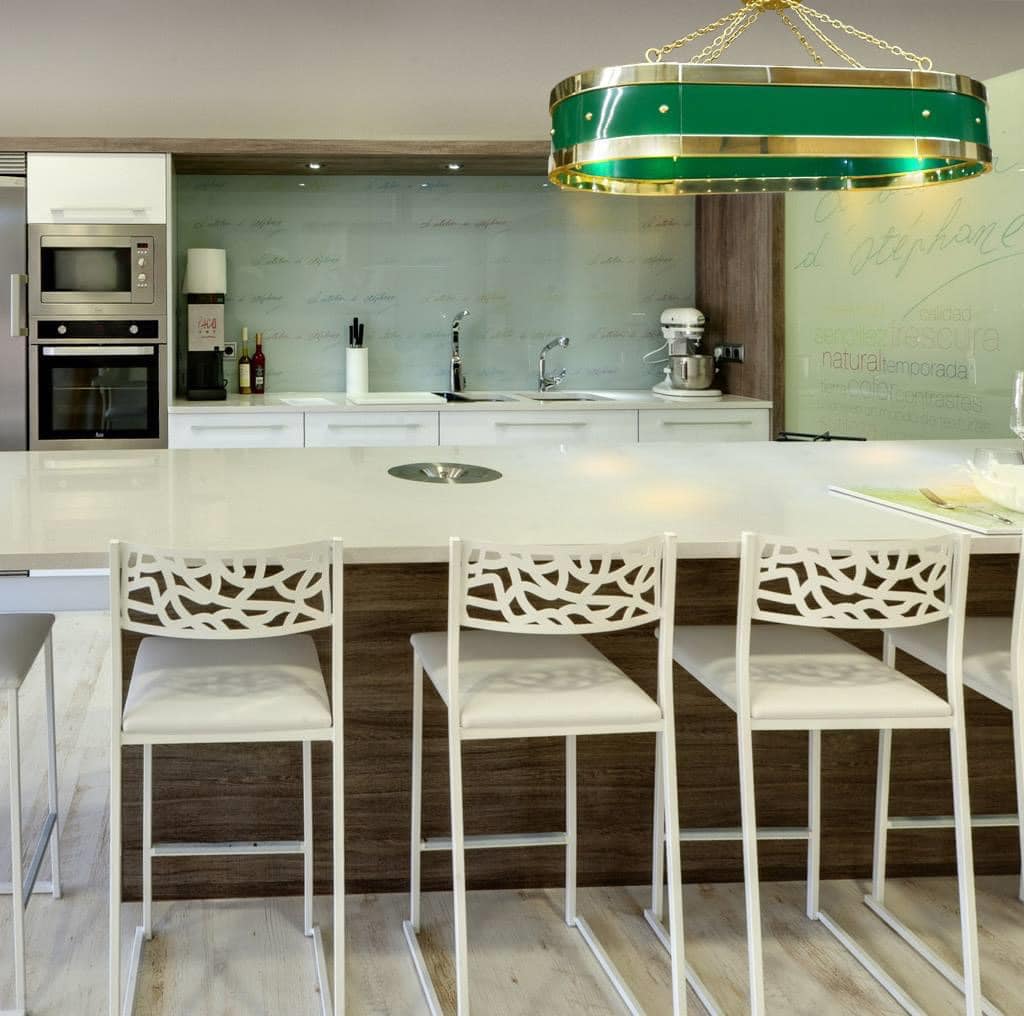 luxury kitchen with green range hood