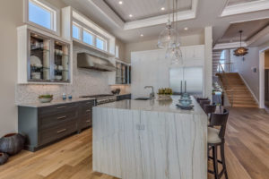 beautiful kitchen with a range hood and fan