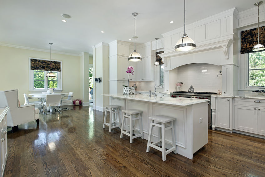 Large kitchen with white cabinetry