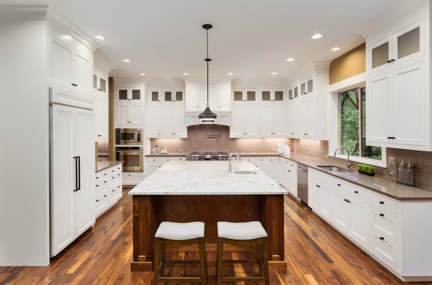 Large Kitchen Interior with Island, Sink, White Cabinets